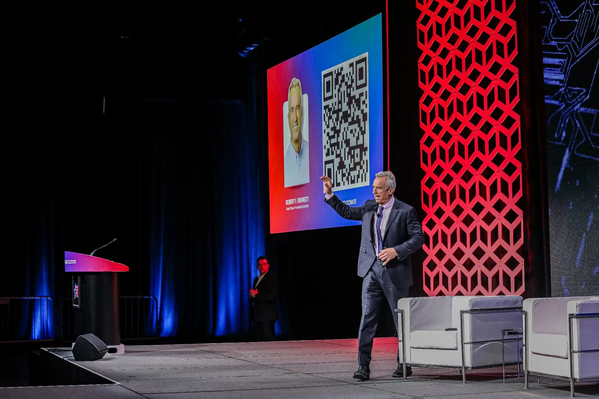 A Downstage-produced conference keynote stage with speaker and large screens